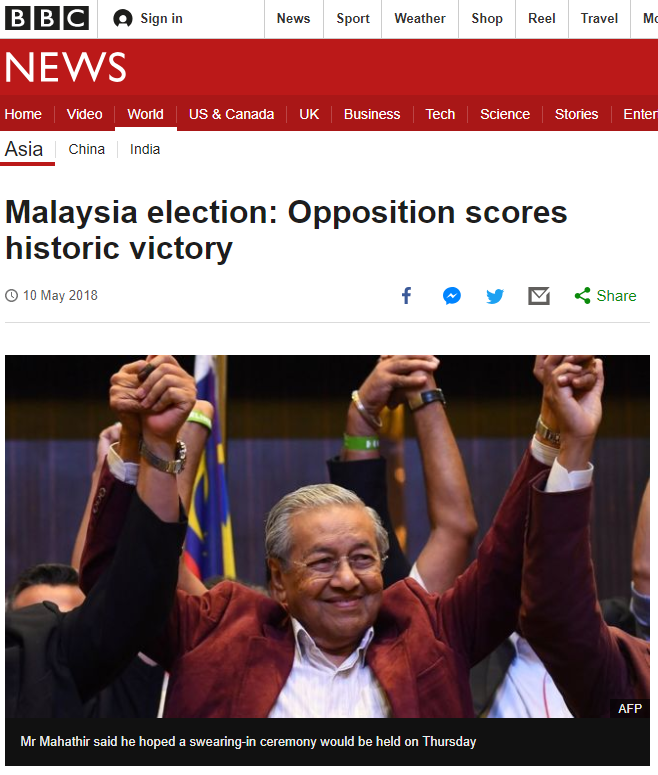 BBC News screenshot Malaysian Prime Minister raising hands in victory