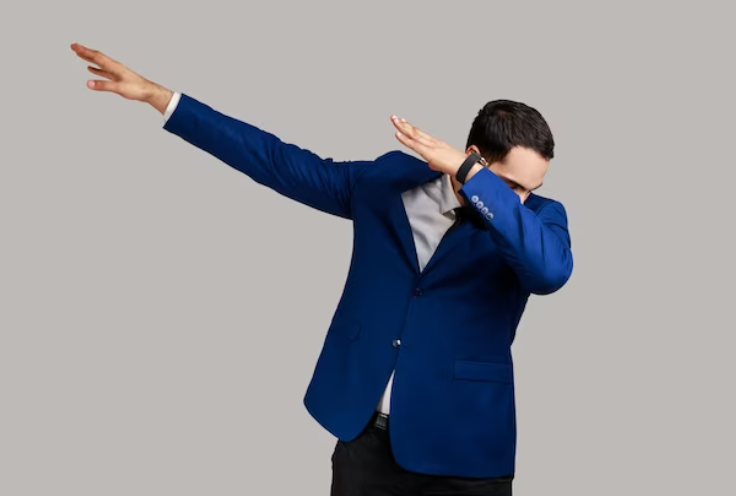 stock image man in a suit doing a dab pose with his arms